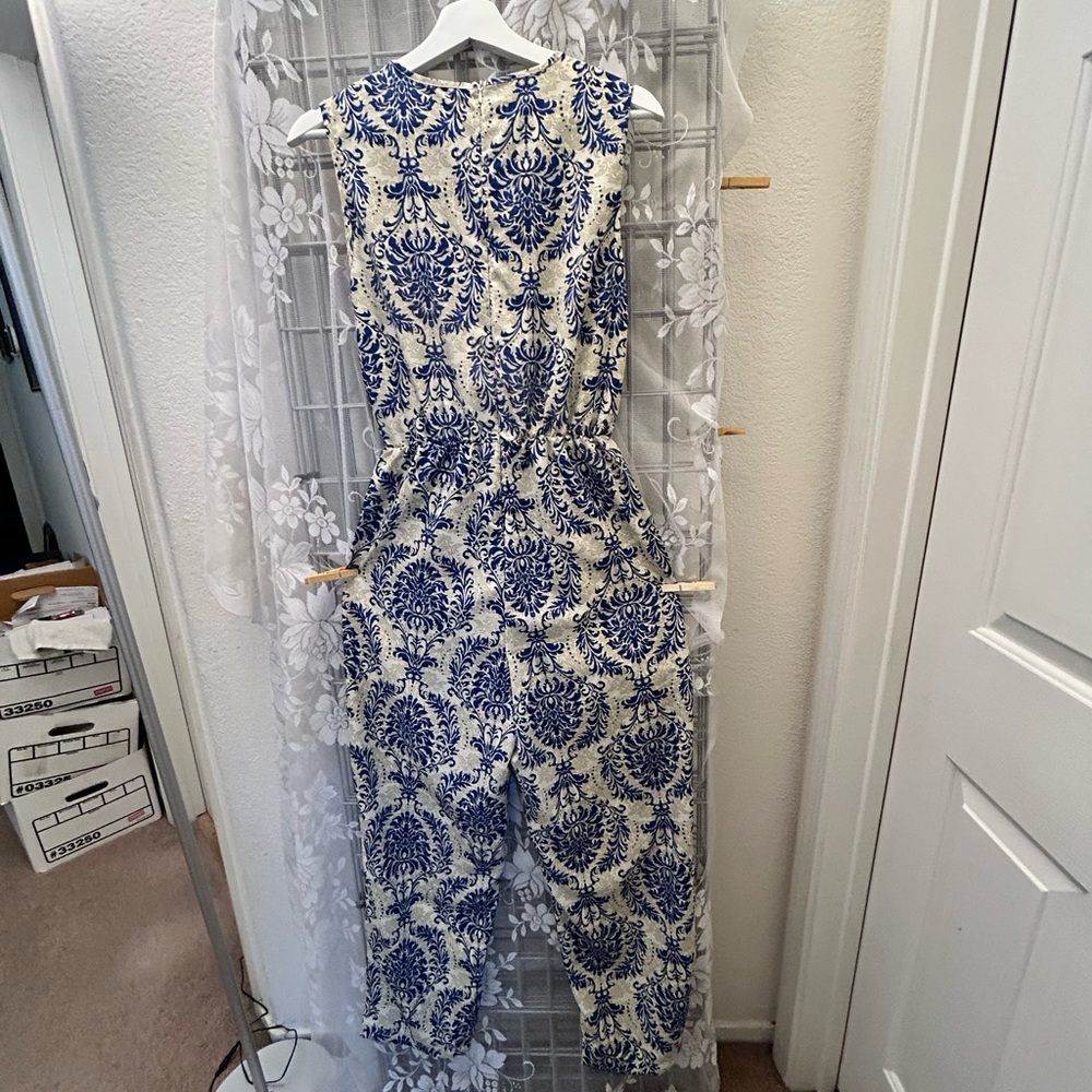 Adorable sleeveless Jumpsuit 100 Polyester! NWOT did not fit